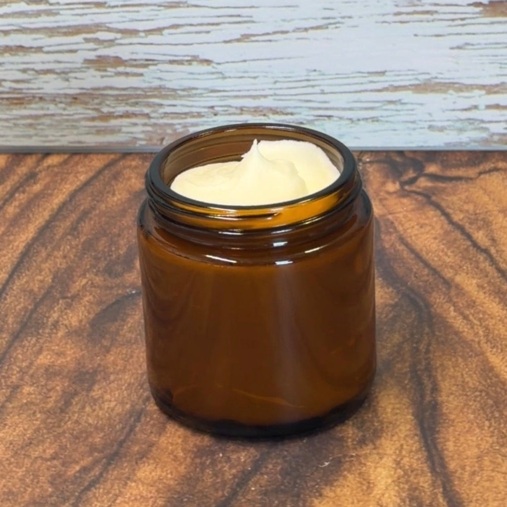 Brown jar with whipped tallow on a wooden surface 4oz jar