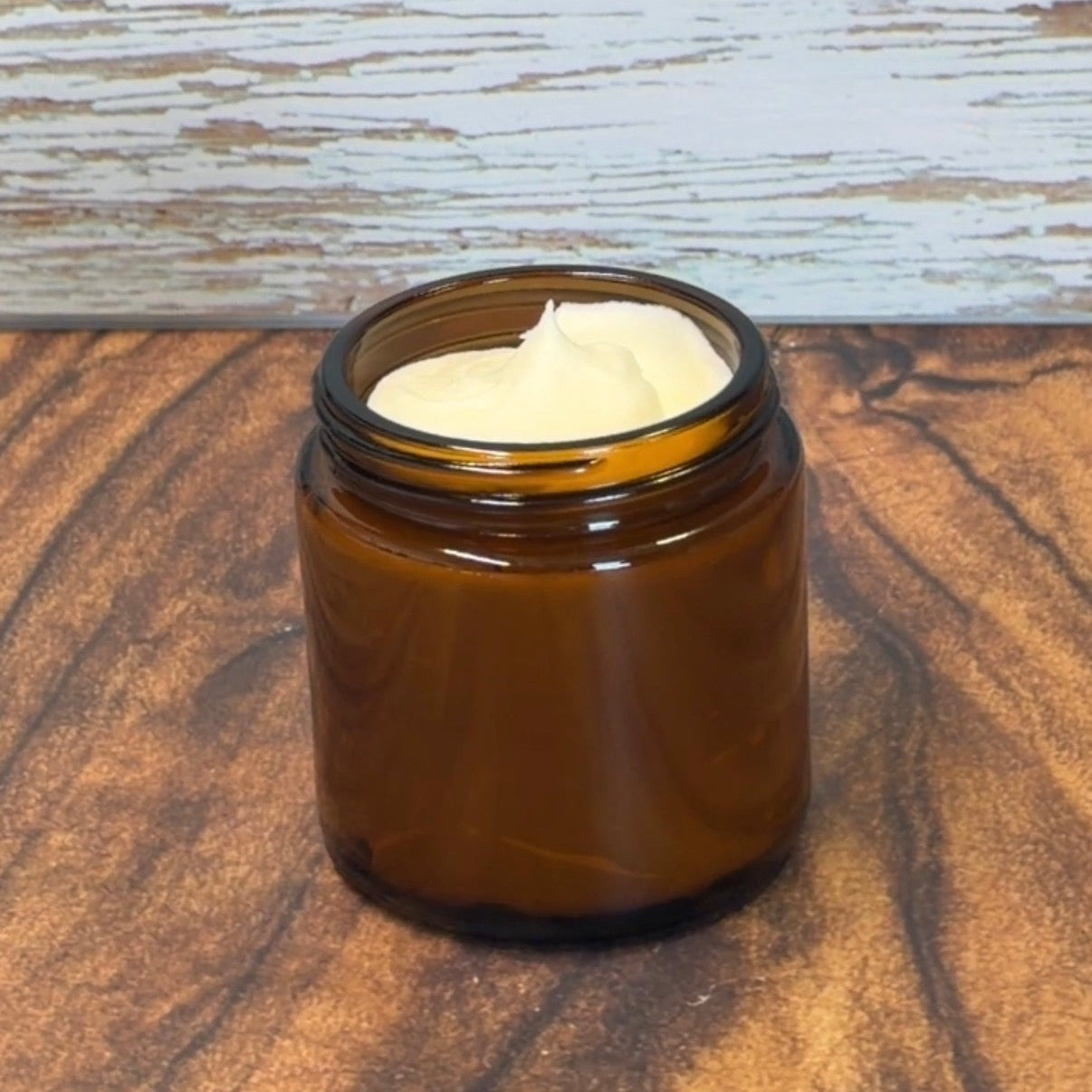 Brown jar with whipped tallow on a wooden surface 4oz jar